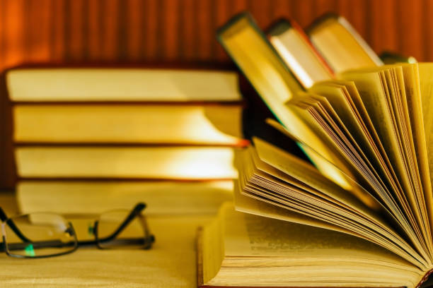 istock on the table are many books and glasses. 886884536