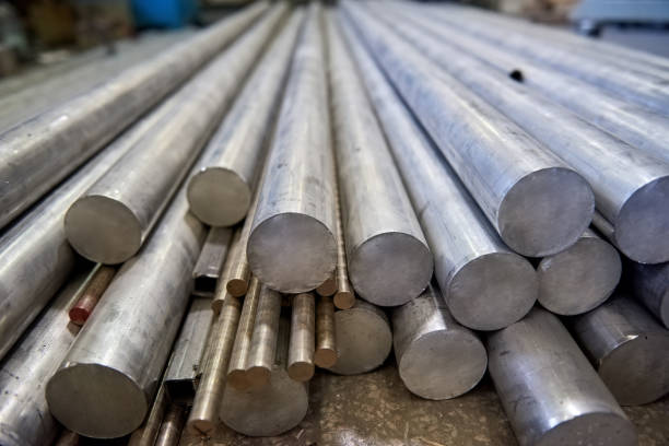 Pile of metal rods. Pile of metal rods. Stainless steel bars. raw stock pictures, royalty-free photos & images