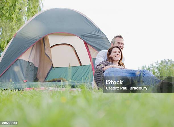 Couple Camping In Remote Area Stock Photo - Download Image Now - 30-39 Years, 35-39 Years, 40-44 Years