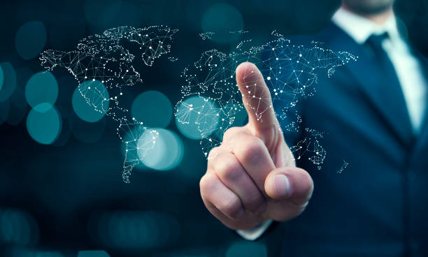 istock Business man pointing on the touch screen with world map 886891938