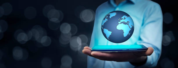 istock businessman hand phone with globe in screen 886891942