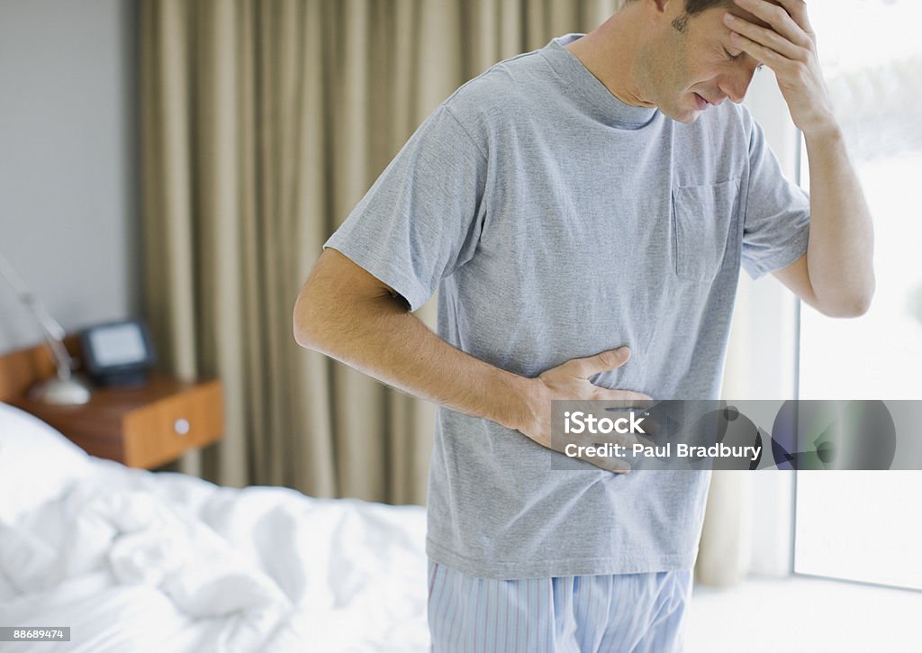 Man with stomachache and headache  Stomachache Stock Photo