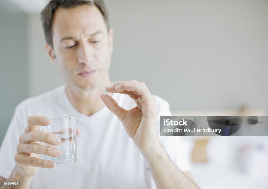 Man taking medicine  Men Stock Photo