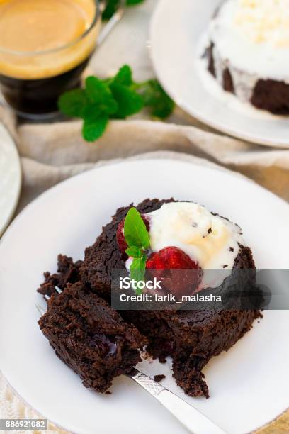 Molten Chocolate Cake Fondant With Vanilla Ice Cream And Strawberry Stock Photo - Download Image Now