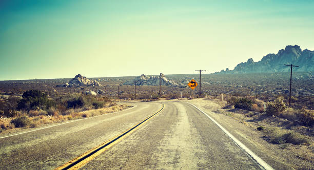 istock Desert highway, travel concept, USA. 886921230