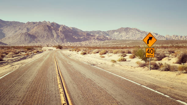 istock Desert highway with speed limit sign, USA. 886921482