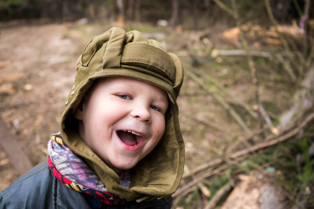 istock Little boy in a tank helmet 886926800