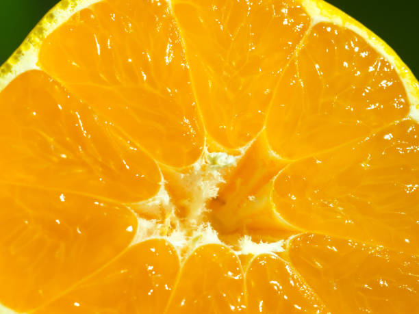 istock Close-up mandarin split in two. Use for vitamins and healthy life 886926868