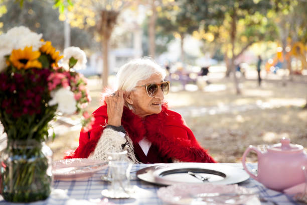 istock Grandmother in public park 886927328