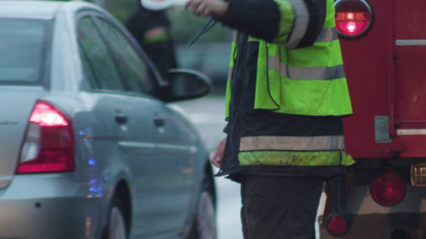 istock Firefighters in Uniforms Regulationg Traffic 886927336