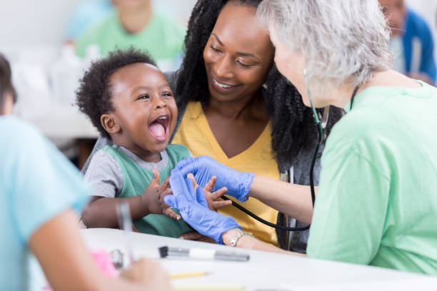 istock Pediatrician examines happy baby boy 886933864