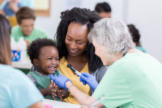 istock Doctor examines adorable baby boy 886933878