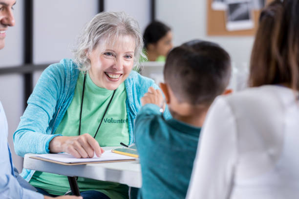 istock Confident senior doctor talks with young patient 886933882