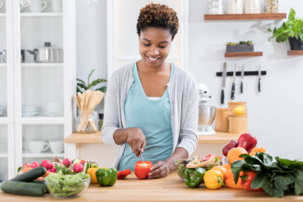 istock Woman prepares a healthy meal 886934398