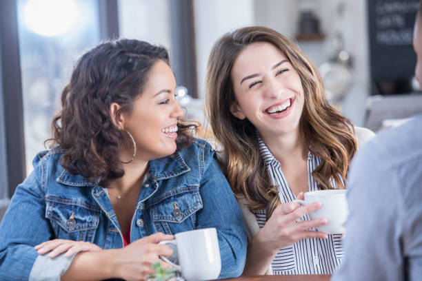 istock Three friends enjoy visiting in their local coffee shop 886934470