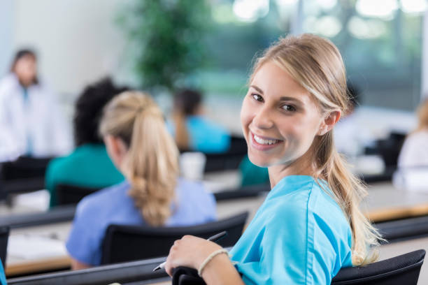istock Confident female nursing student attending lecture 886934784