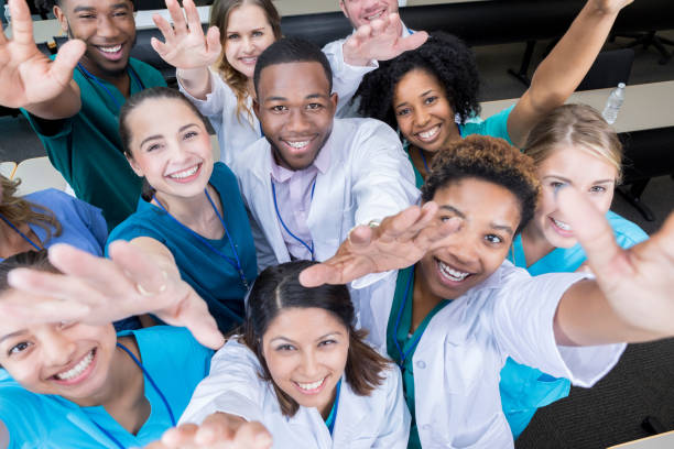 selfie von medizinischem fachpersonal bis - human hand waving human arm high angle view stock-fotos und bilder