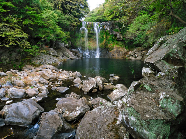famous cheonjeyeon waterfall in jeju south korea