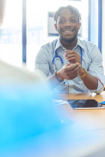 istock Happy doctor with patient 886942914