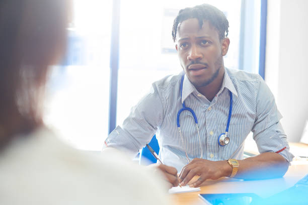 istock Doctor writing out prescription for patient 886945354