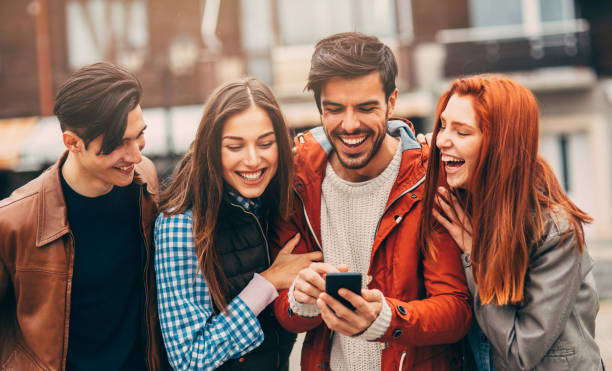 istock Friends texting in the city 886946142