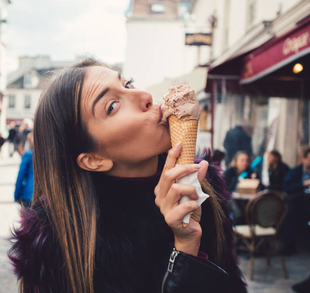 istock Cute girl eating ice-cream 886946808