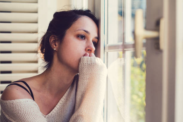 istock Depressed woman at home 886946926