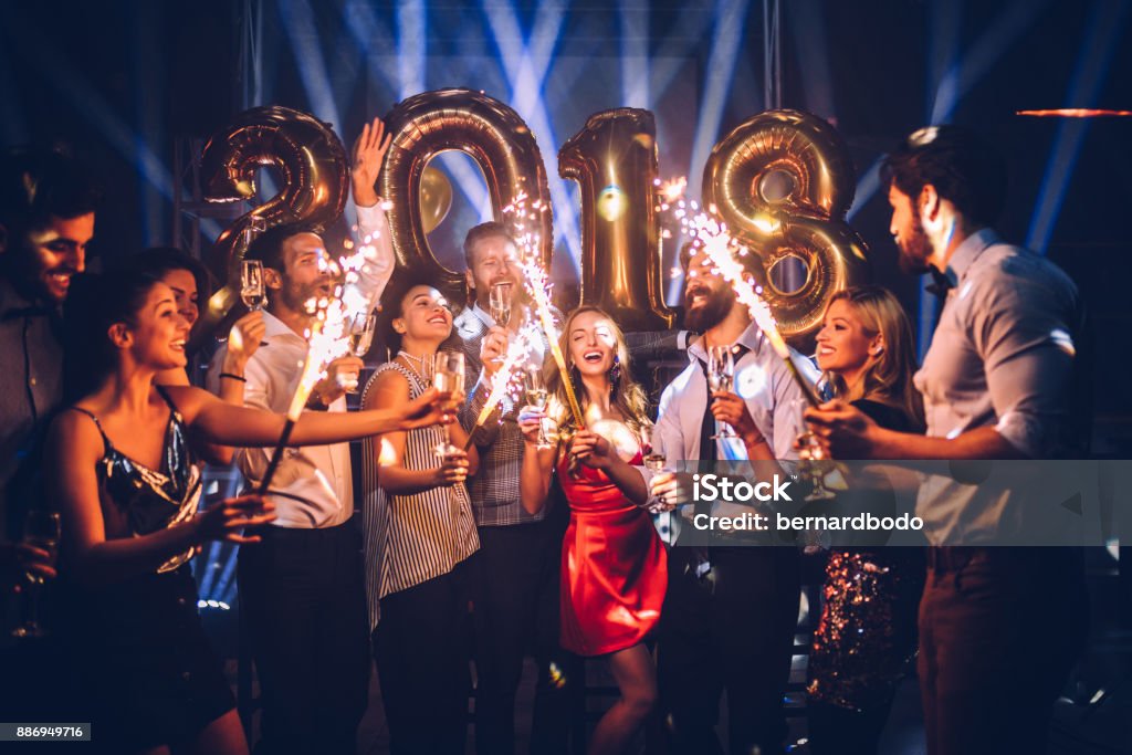 For a sparkling New Year ! Group of friends celebrating New Year Celebratory Toast Stock Photo