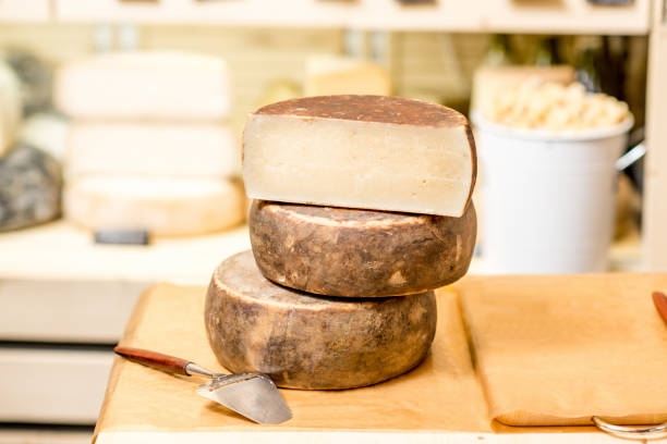 istock Seasoned cheese with slicer on the table 886954022