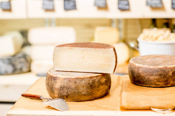 istock Seasoned cheese with slicer on the table 886954866