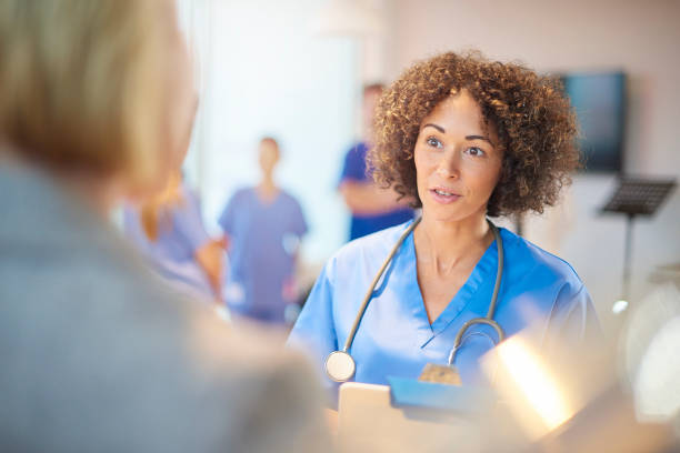 istock female doctor in staff briefing 886955480