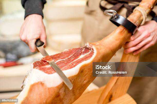 Cutting Prosciutto Leg Stock Photo - Download Image Now - Ham, Cutting, Serrano Ham