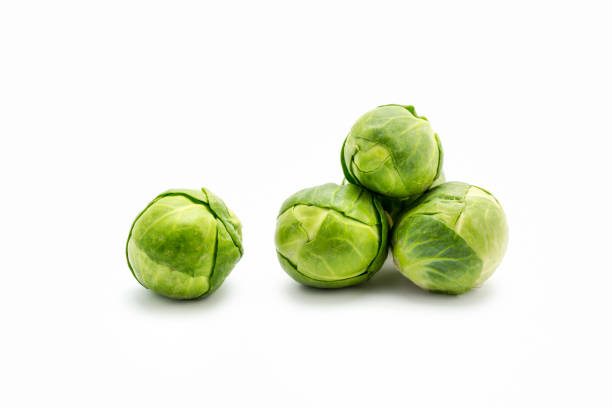 Fresh green Brussels sprouts isolated on white background