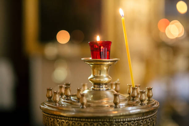 istock Burning candles in church 886968792