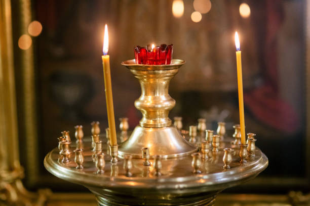 istock Burning candles in church 886968842