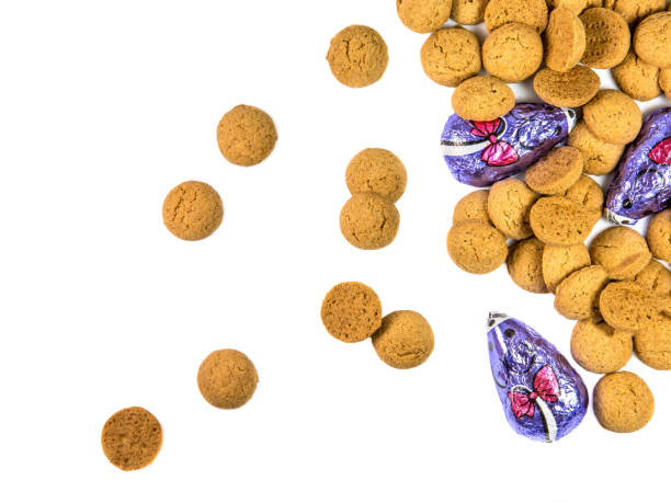 istock Bunch of scattered Pepernoten cookies and chocolate mice 886974830