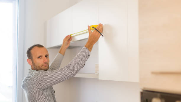 istock Architect taking measures of a brand new kitchen. Home style and design concepts 886975476