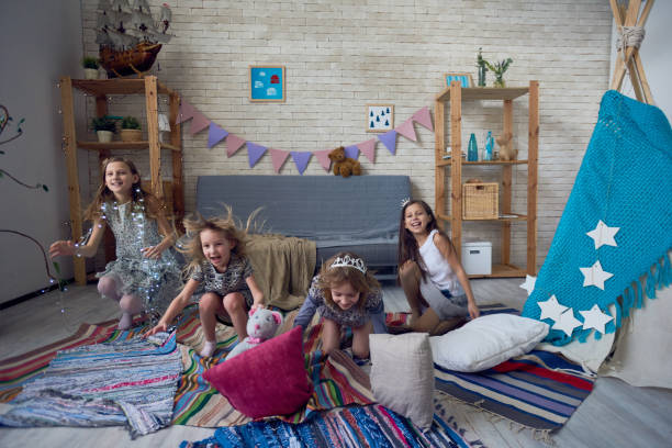 istock Expressive kids having fun in playroom 886978068