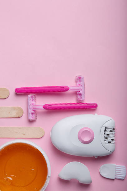 istock Set for depilation. Wax, epilator, razor and spatula. View from above. 886978254