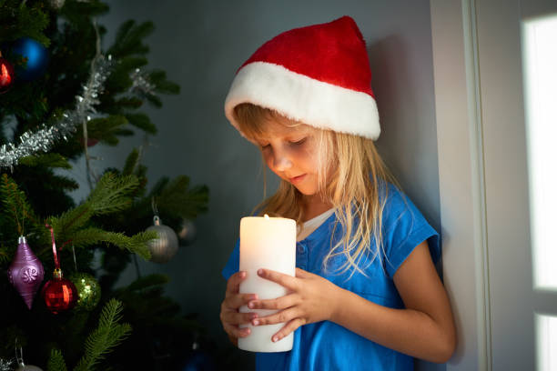 istock Dreamy cute kid with candle 886987018