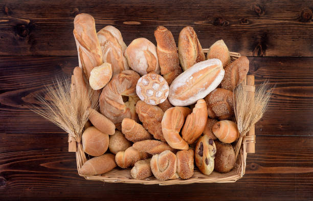 istock Basket with fresh baked bread of various sizes 886992074