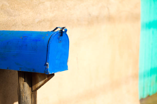 Vintage Blue Rural Mailbox, Green Door. Shot in New Mexico.