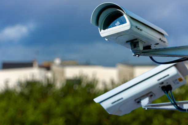 istock security CCTV camera or surveillance system with residential dwellings on blurry background 887034864