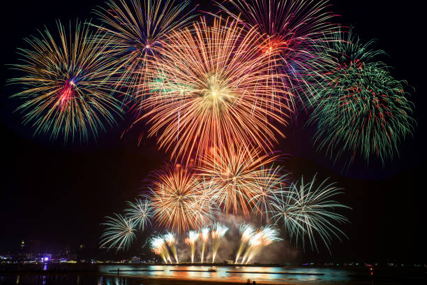 istock Beautiful firework display on celebration night, showing on the river 887035284