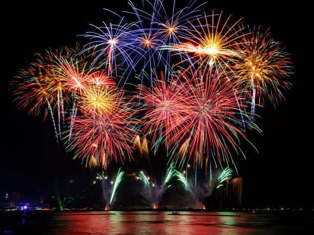 istock Beautiful firework display on celebration night, showing on the river 887035348