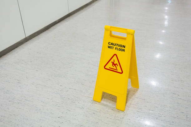 Signs plastic yellow put on floor text caution wet floor Signs plastic yellow put on floor text caution wet floor in hospital put down stock pictures, royalty-free photos & images