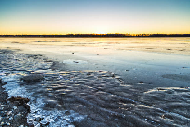 istock Ice Forming on Lake at Sunset 887050184