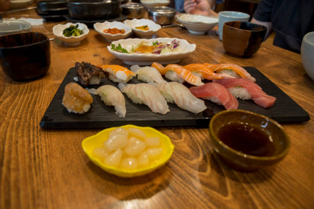суши на столе - nigri sushi стоковые фото и изображения