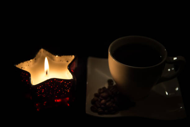 istock Hot coffee with a Christmas candle 887074974