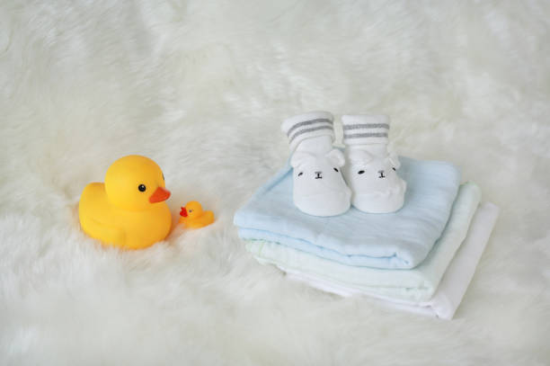istock Collection of items for newborn babies on white fur. 887080836